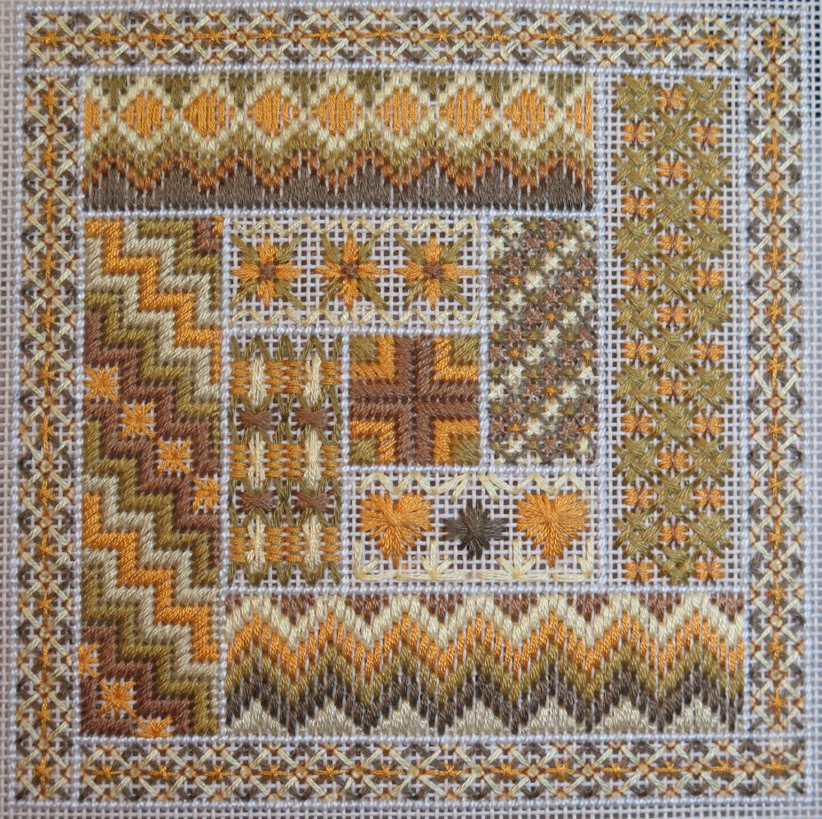 Canvaswork sampler in golds and browns